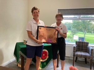 Lady Captain- Charlie-Wade-receiving-the-LLCGA-2023-trophy-from-Lancashire-Ladies-County-Captain-Agnes-King